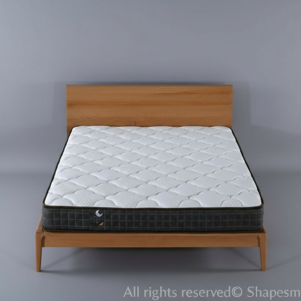 White mattress on a wooden bed frame in a room with side tables and decor.