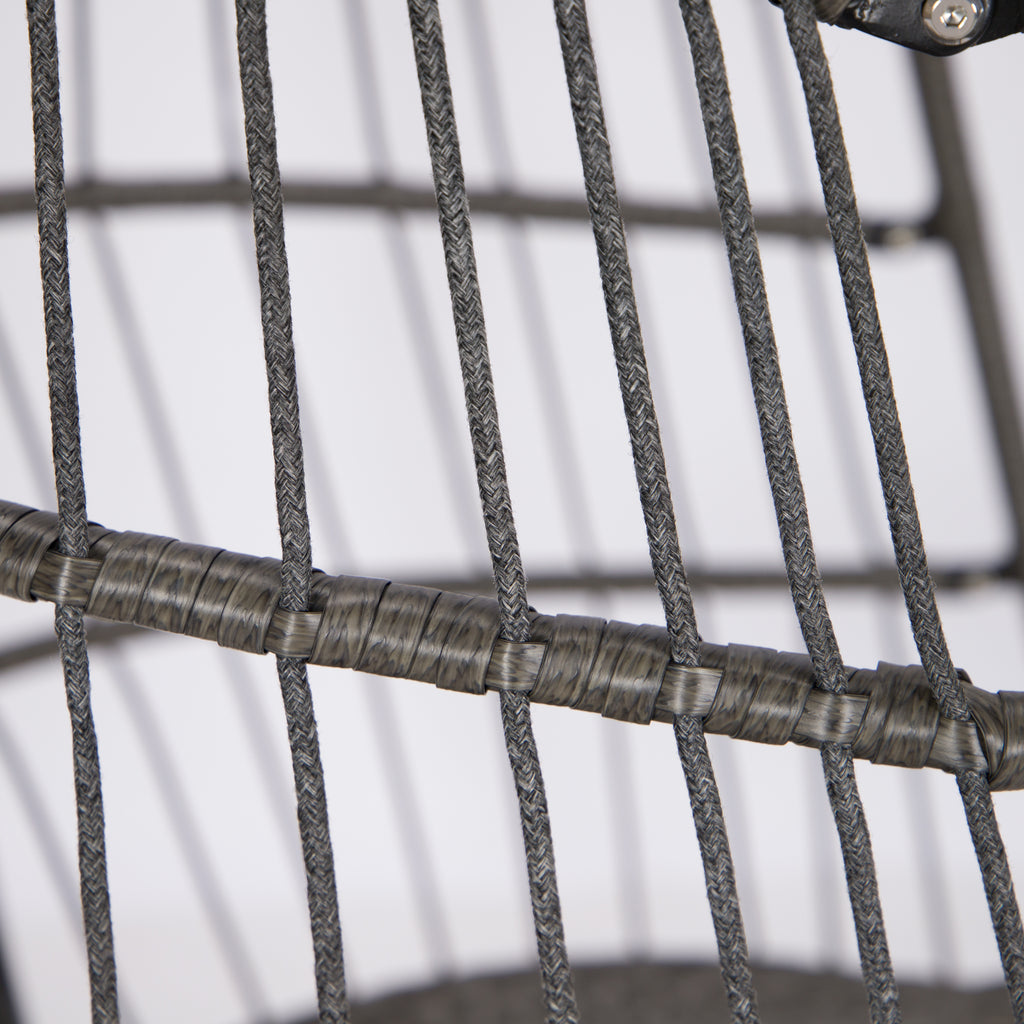 Close-up of a woven wire chair with a plain background