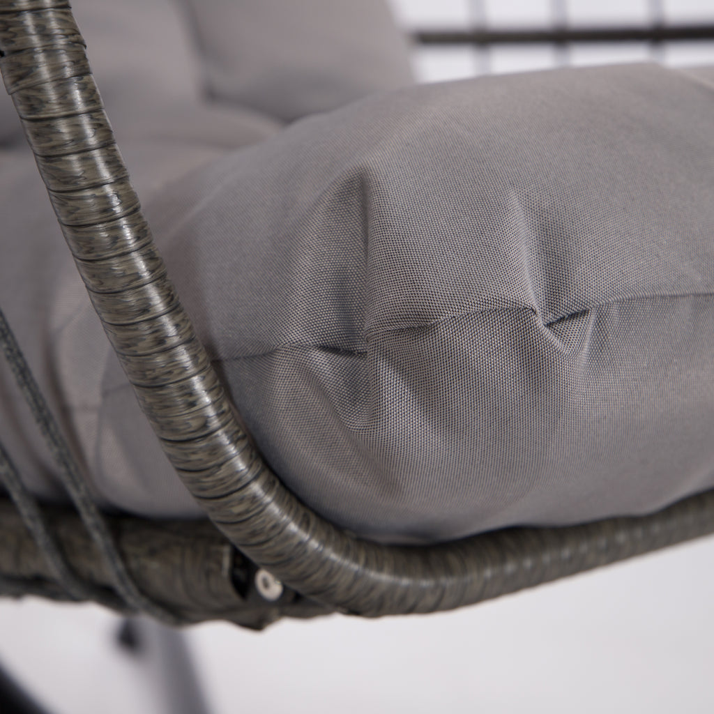 Gray cushion on a wicker chair with a blurred background