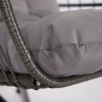 Gray cushion on a wicker chair with a blurred background