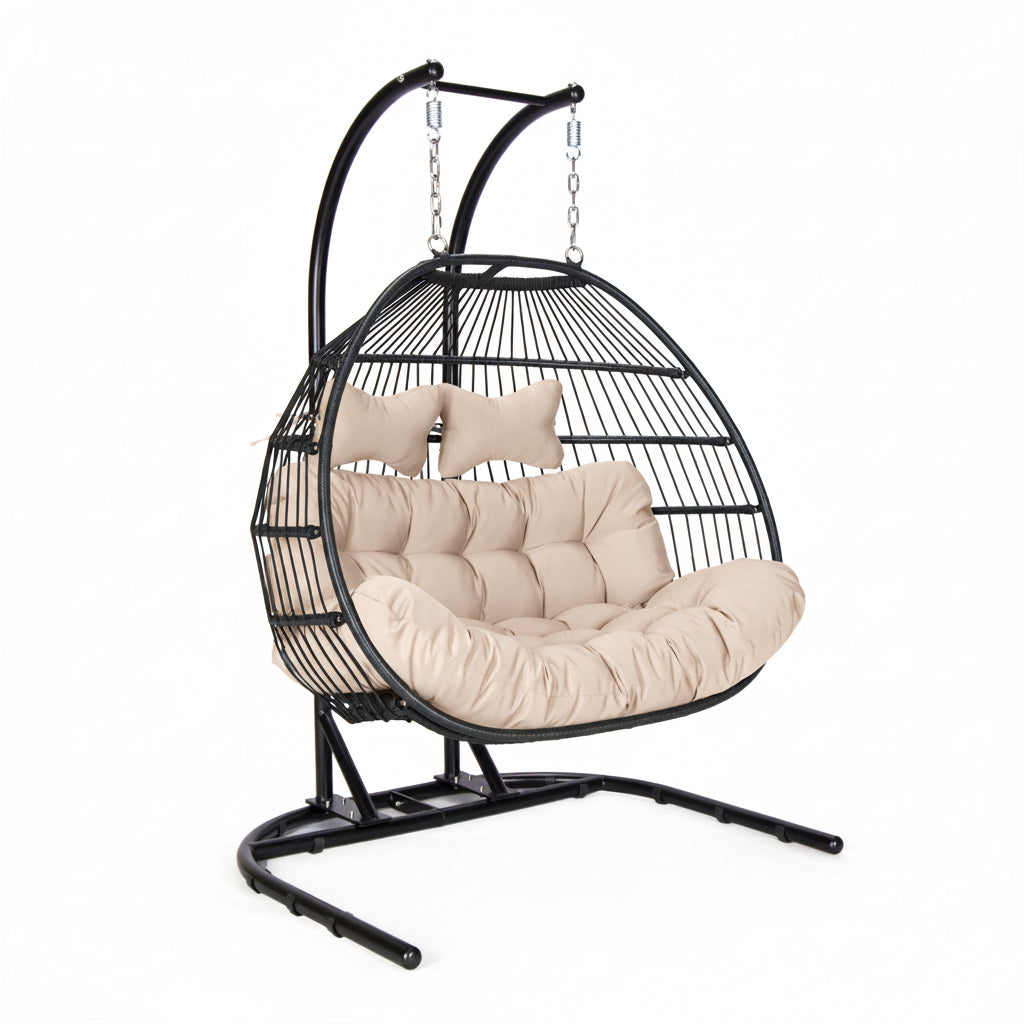 Hanging egg chair with beige cushions on a white background