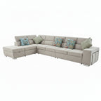 Living room with a sectional sofa, coffee table, and framed photos on the wall.