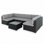 Gray sectional outdoor sofa with a matching coffee table on a white background
