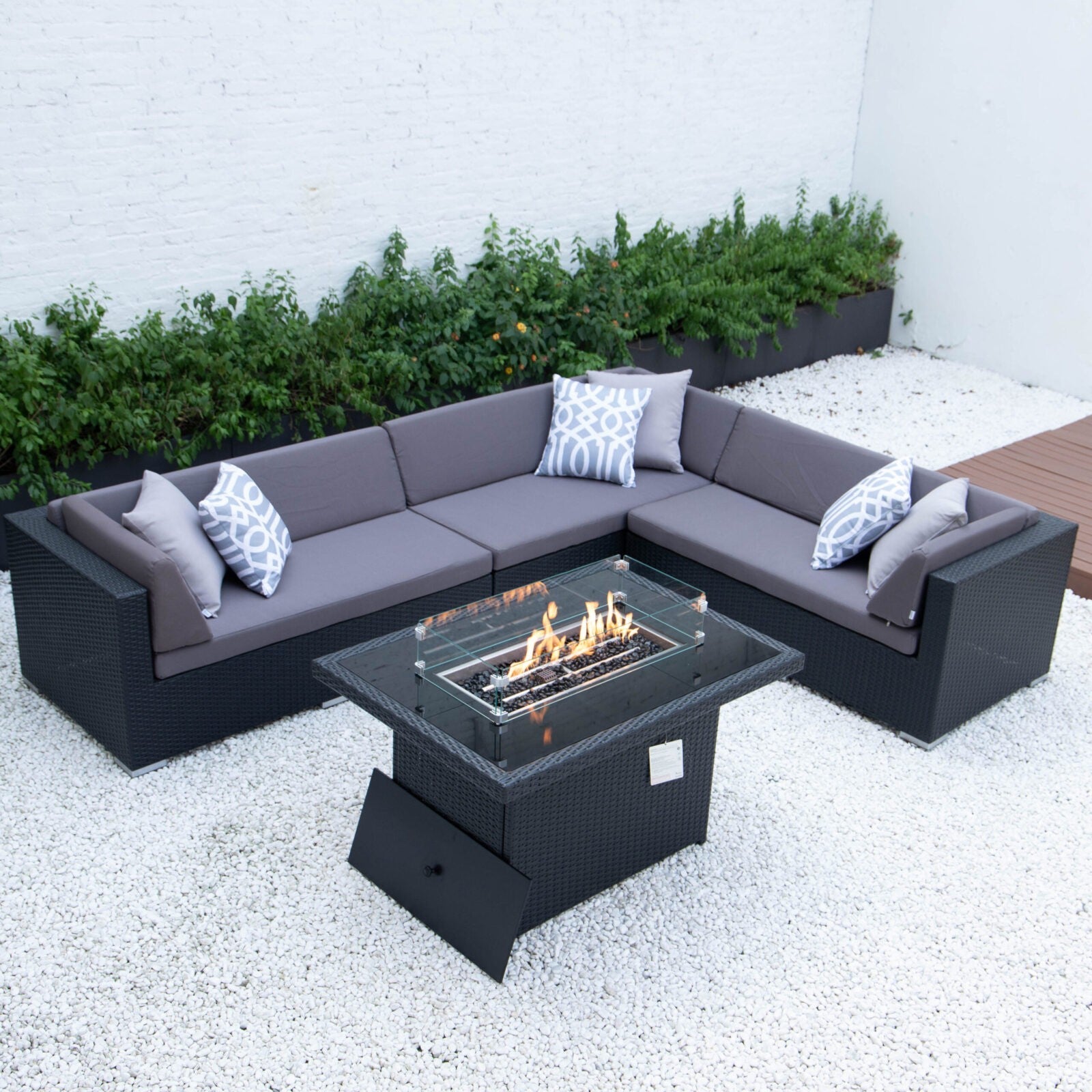 Giant L with wicker fire table in dark grey cushions image 0