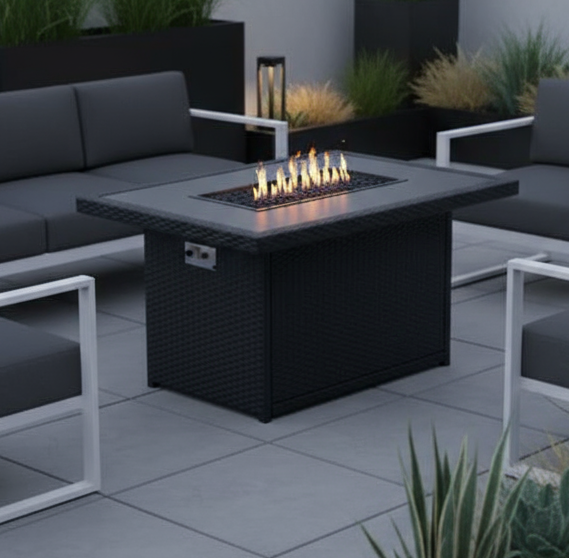 Outdoor patio setup with black furniture, fire pit, and plants on a rooftop.