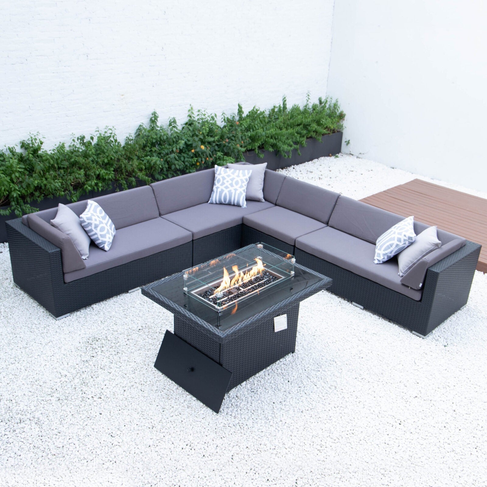 Giant symmetrical L with wicker fire table in dark grey cushions image 0