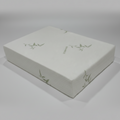 White rectangular box with a textured surface on a white background