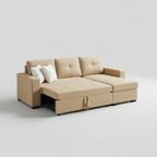 A beige upholstered sectional sofa with a chaise lounge and tufted back cushions, shown in a bright modern living room with a city view window, white shelves, and a light rug.
