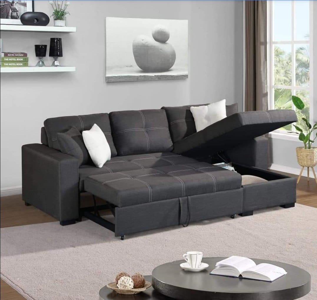 Gray sectional sofa with storage drawers in a living room setting.