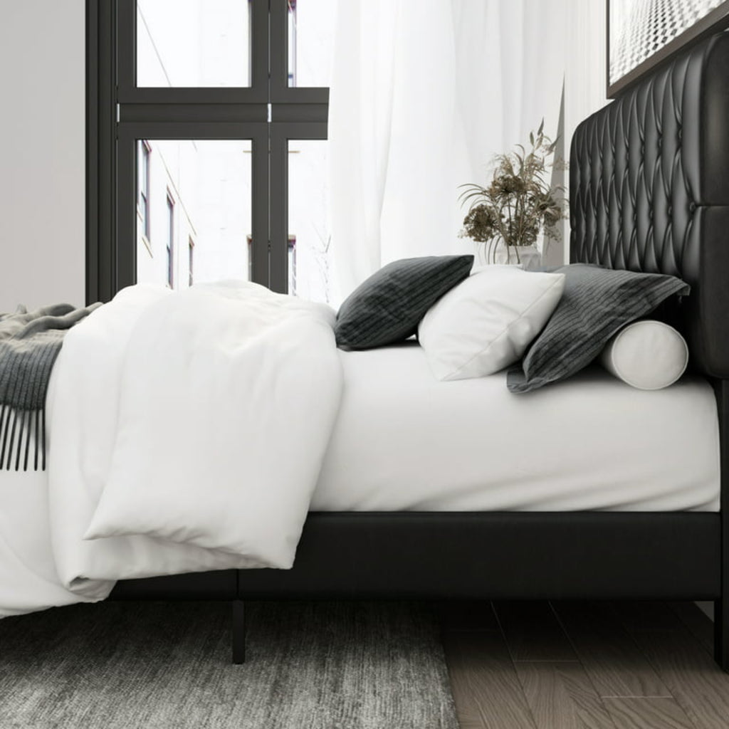 Bedroom with a bed featuring white bedding and dark headboard.