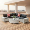 Outdoor patio furniture set with cushions by a pool