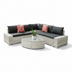 Outdoor patio furniture set with cushions by a pool
