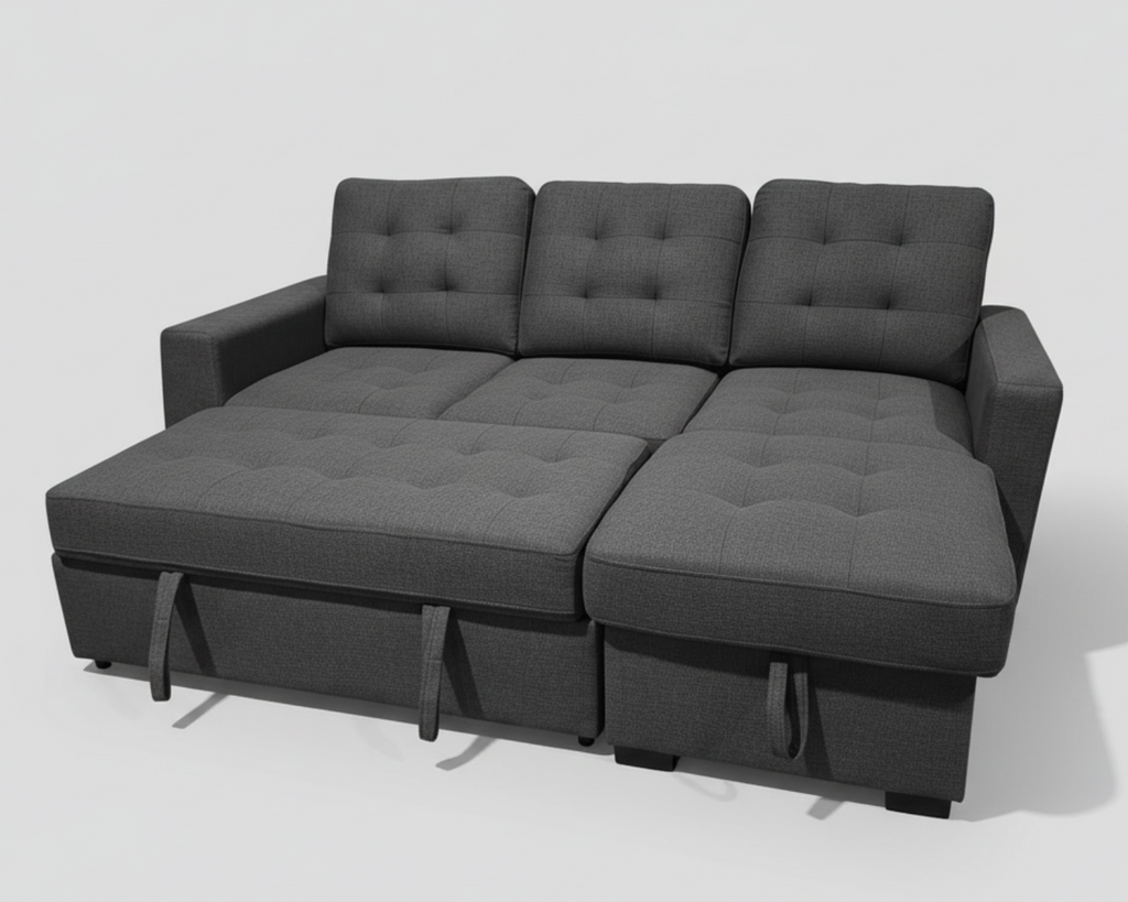 Gray sectional sofa in a room with plants and a wooden floor.