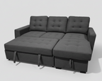 Gray sectional sofa in a room with plants and a wooden floor.
