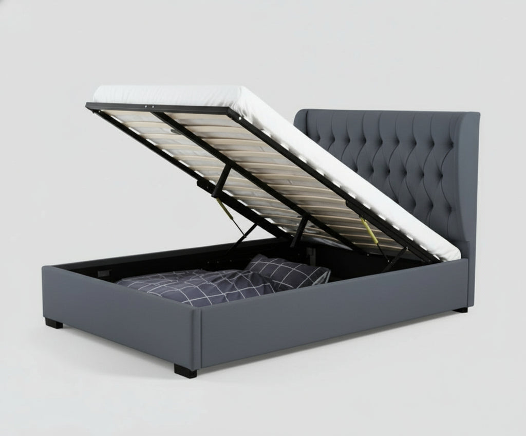 Gray upholstered bed with storage compartments in a room with a window and decor.