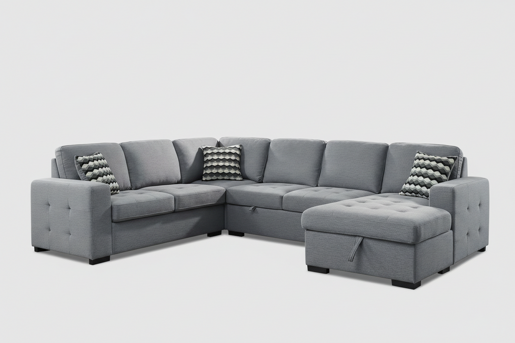 Gray sectional sofa in a living room with large windows and a rug.