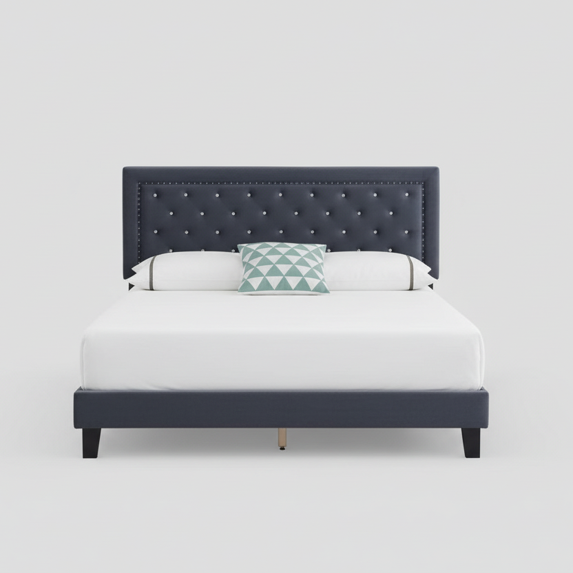 Bed with tufted navy headboard and white bedding on a light gray background
